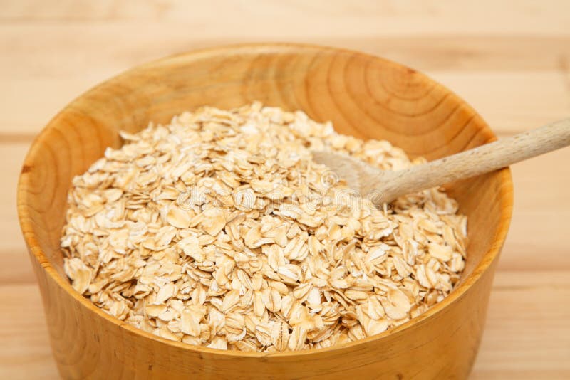 Bowl of Dry Oats with Wood Spoon Stock Photo - Image of brown, grain ...