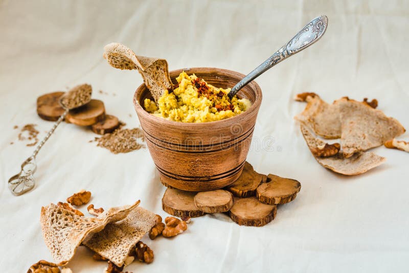 Bowl of Fresh Fish Pate beside Chips, Cackers and Walnuts Stock Photo
