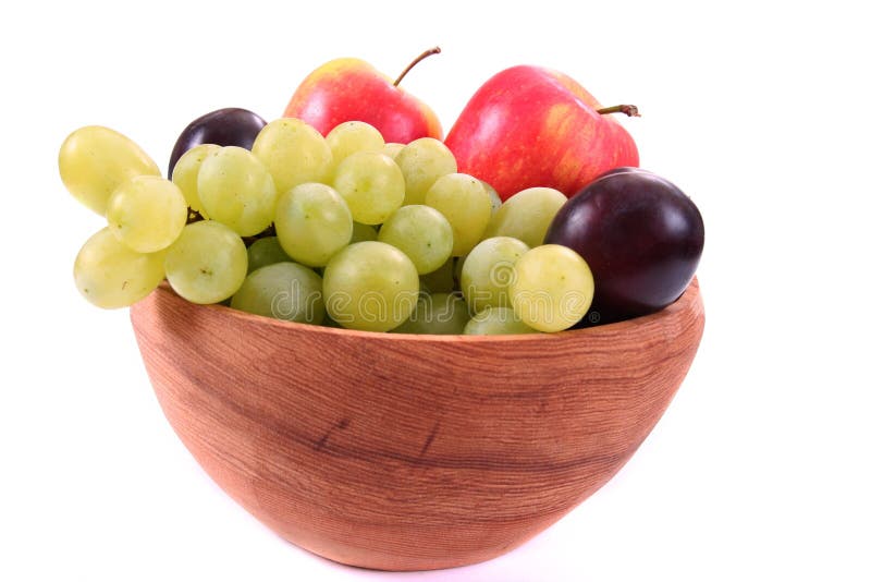 Bowl of fresh mixed fruit in wooden bowl