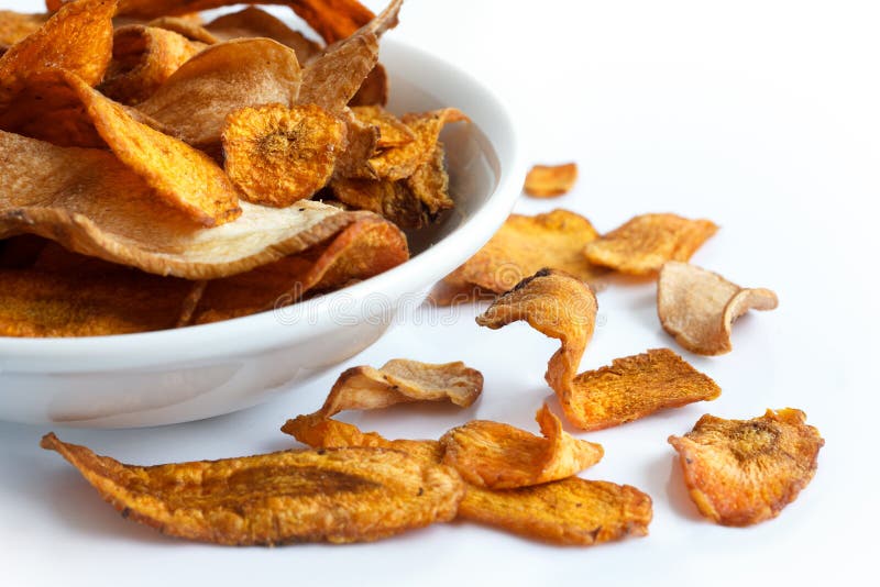 Bowl of Fried Carrot and Parsnip Chips. on White. Stock Image Image