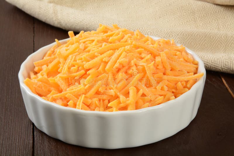 Bowl of Grated Cheddar Cheese Stock Photo Image of product, napkin