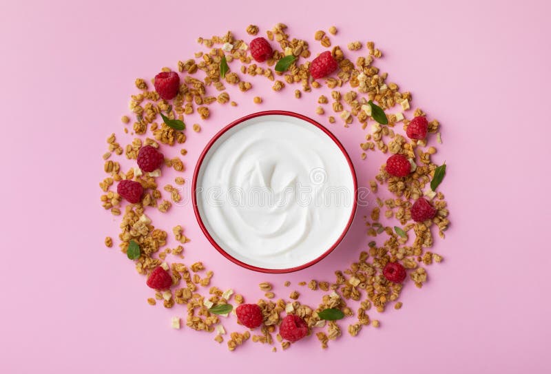 Bowl with greek yogurt and ingredients from raspberries and granola. Top view flat lay. Healthy breakfast stock photos Bowl with greek yogurt and ingredients from raspberries and granola. Top view flat lay. Healthy breakfast stock photos