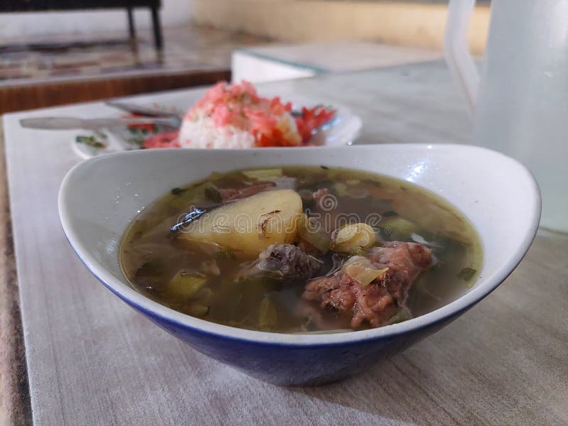 A Bowl of Hot Soup in a Bowl on the Table and Ready To Eat Stock Photo