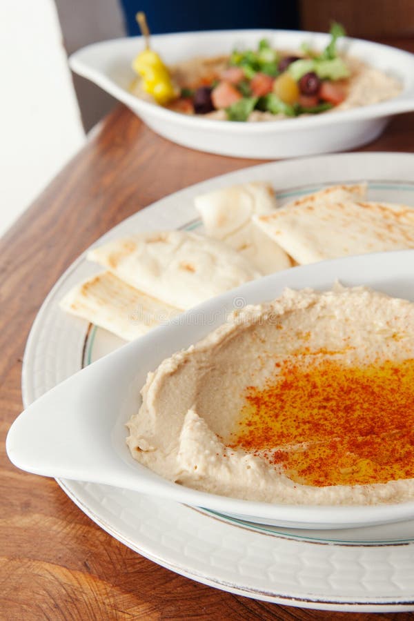 Bowl of hummus and salad stock photo. Image of chickpea 28977966