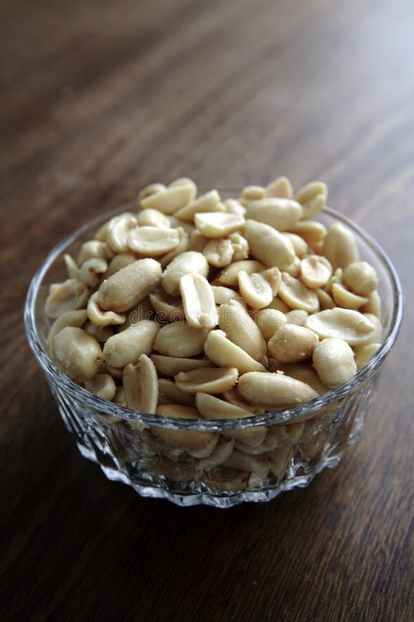 Peanuts in a glass bowl stock photo. Image of salt, peanuts 1465772