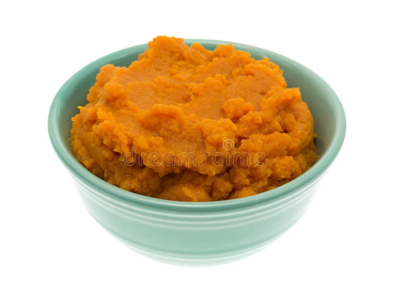 Bowl of pumpkin pie filling on white background