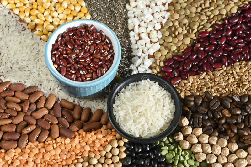 Bowl with Raw White Rices and Beans on Various Seeds Grain Stock Photo