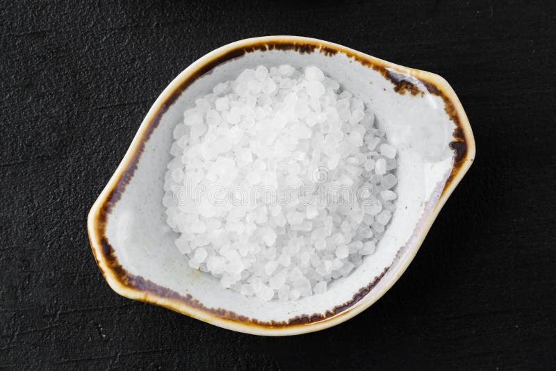 Bowl with Salt on Black Background