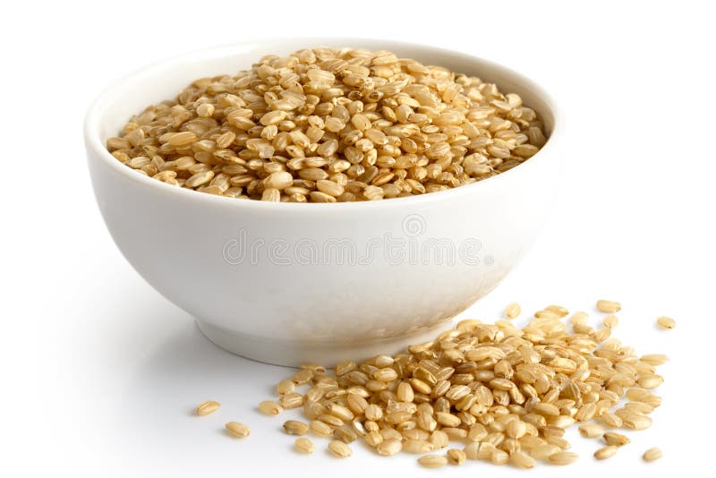 Bowl of short grain brown rice isolated on white.