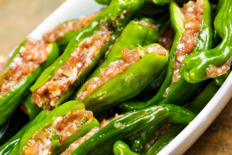 Bowl of Uncooked Fresh Stuffed Green Peppers Ready for Cooking