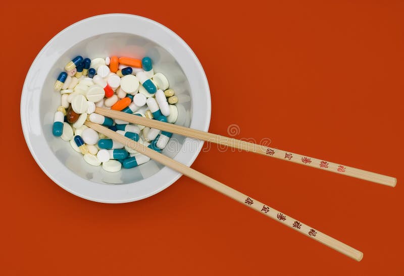 Bowl of vitamins with pills