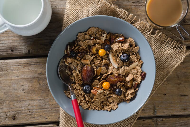 Bowl of Wheat Flakes with Blueberry and Golden Berry Stock Image