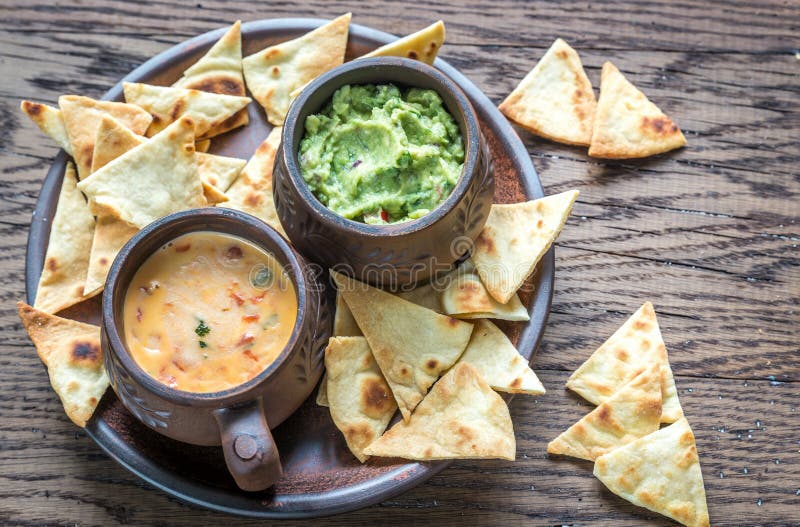 Bowls of Guacamole and Queso with Tortilla Chips Stock Photo Image of