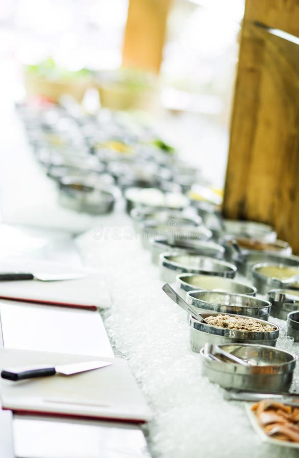 Bowls Of Mixed Fresh Organic Vegetables In Salad Bar Display Wood