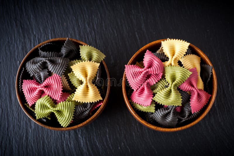 Bowls of pasta farfalle. Ingredients for Italian cooking.