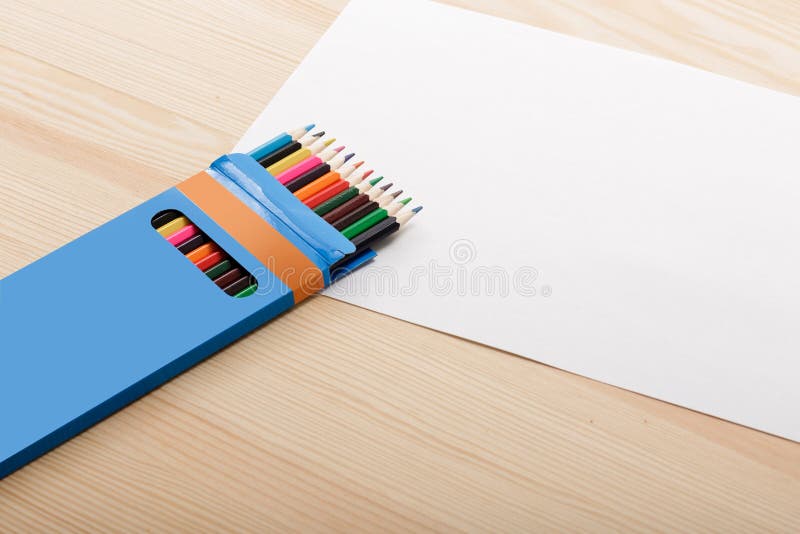 Box of Colored Pencils and Sheet of White Paper Stock Photo Image of