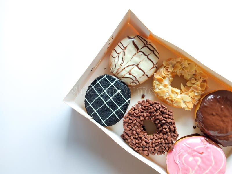 A Box of Donuts with a Variety of Different Toppings. Sweet Dessert