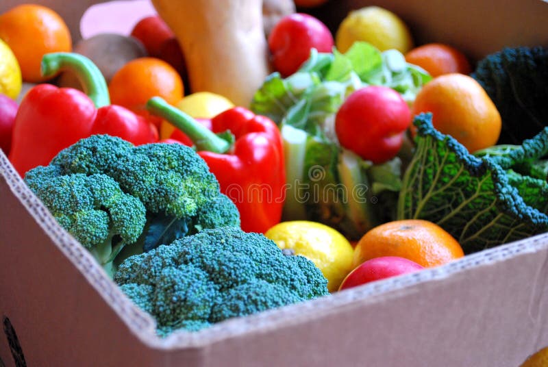 A large colourful box of fruit and vegetables. A large colourful box of fruit and vegetables