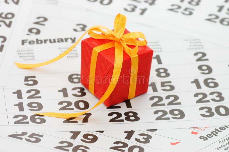 Box with a gift on calendar sheet