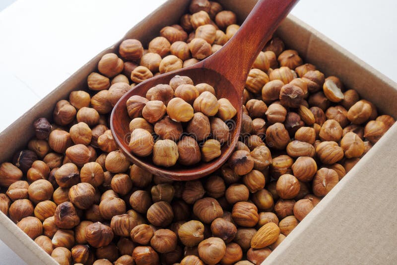 Box with Peeled Hazelnuts. Top View. Delivery of Healthy Nuts in