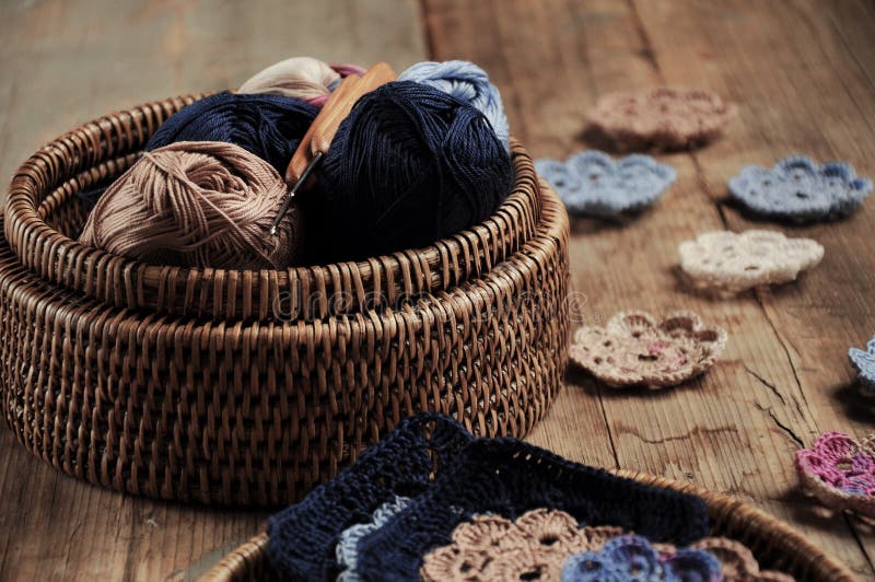 Box of yarn and crocheted flowers royalty free stock photography Box of yarn and crocheted flowers royalty free stock photography