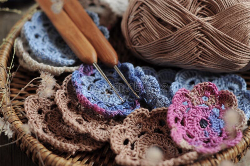 Box of yarn and crocheted flowers