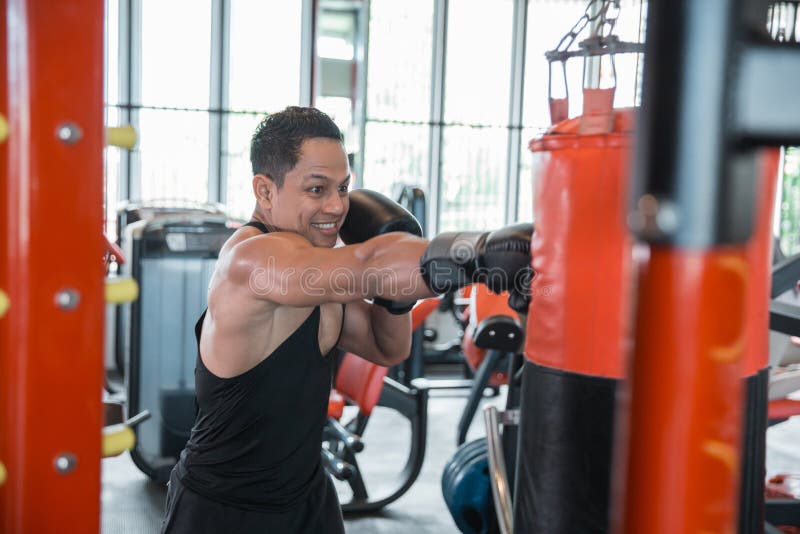 Boxer doing training on a punching bag stock photo Boxer doing training on a punching bag stock photo