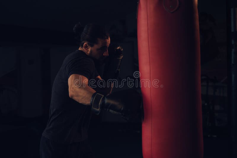 Boxer Hitting the Heavy Bag with Front Jab Stock Image Image of