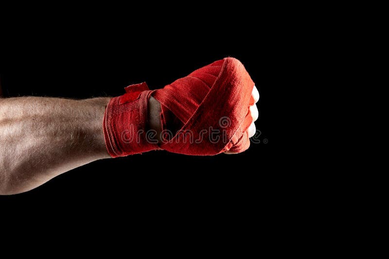 A Boxer`s Red Bandage on His Hand Isolated on Dark Blurred Background