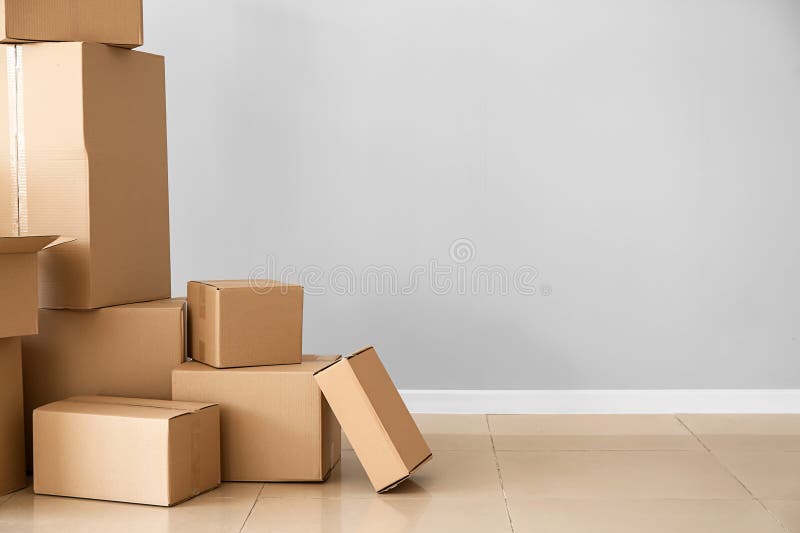 Cardboard Boxes Near Light Wall Stock Photo Image of pack, dispatch