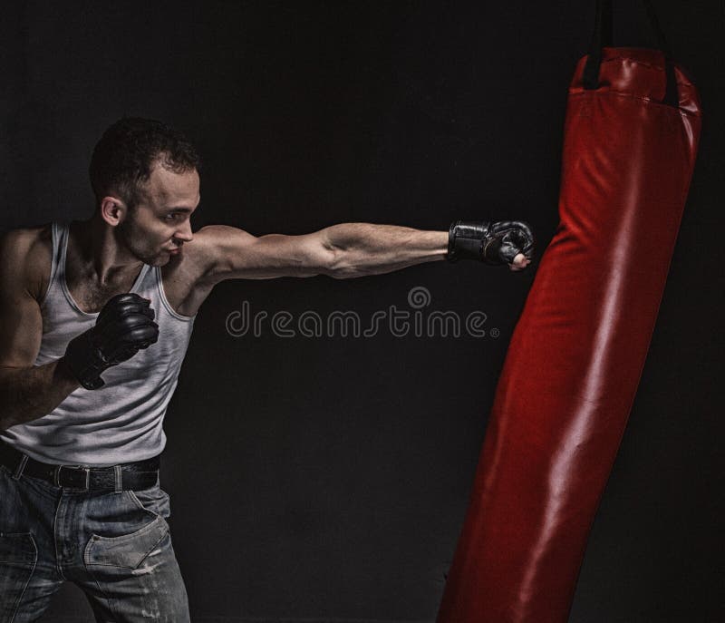 Boxing Kick in the Boxing Bag Stock Photo Image of background