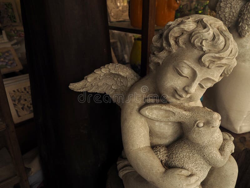 Boy angel sculpture for decorate in a shop. Boy angel sculpture for decorate royalty free stock photos Boy angel sculpture for decorate in a shop. Boy angel sculpture for decorate royalty free stock photos