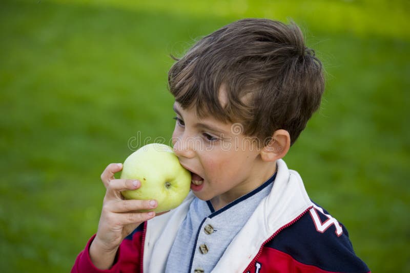Boy with apple and ball