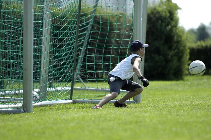 Boy as keeper at a soccer game