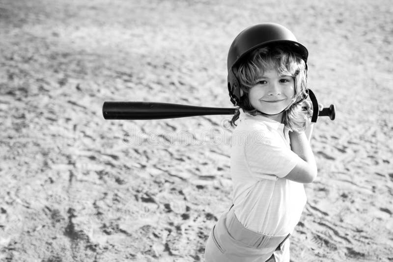 Boy in Baseball Helmet and Baseball Bat Ready To Bat. Stock Image