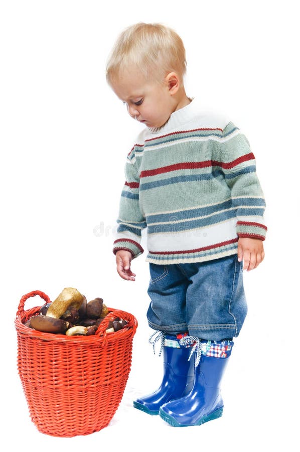 Boy with a basket of mushrooms