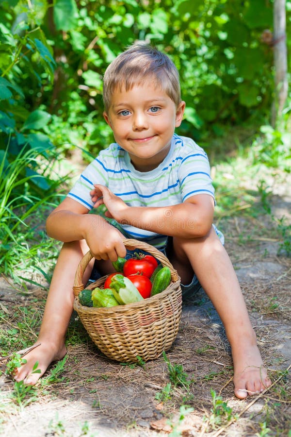 Boy with basket of vegetables