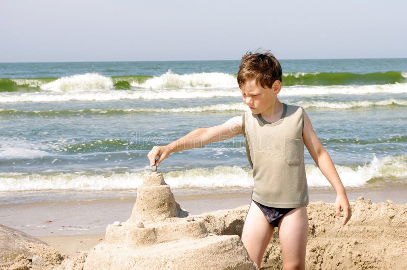 Cute boy at beach stock photo. Image of turquoise, exotic - 68223728