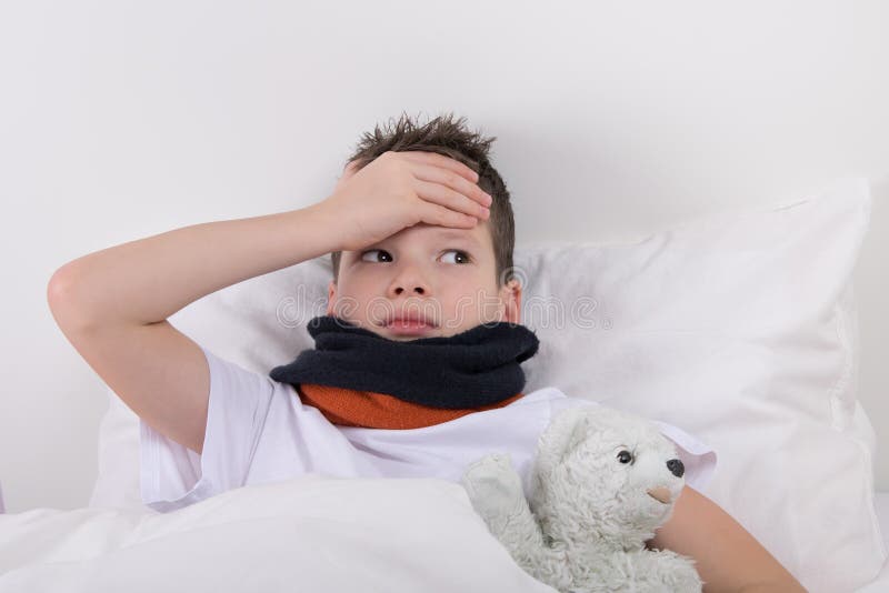 The Boy in Bed, His Head Hurts Stock Photo Image of care, illness
