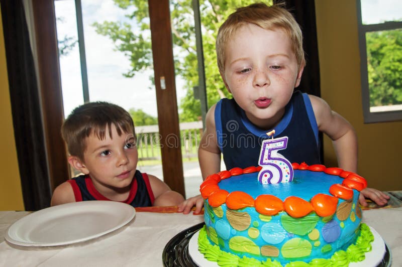 Boy blowing out birthday candle royalty free stock image Boy blowing out birthday candle royalty free stock image