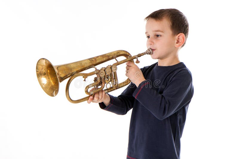 Boy Blowing into a Trumpet Against White Background Stock Photo Image