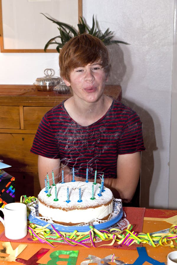 Boy blows out his birhday candles