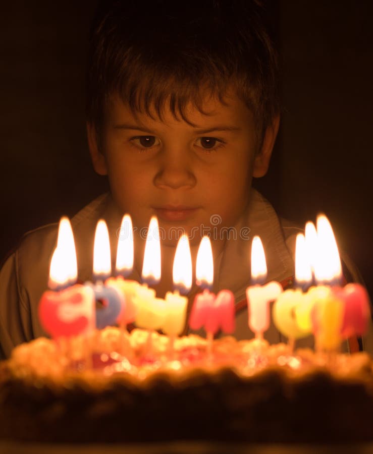 Boy and burning candles stock image. Image of sight, burn 4011745