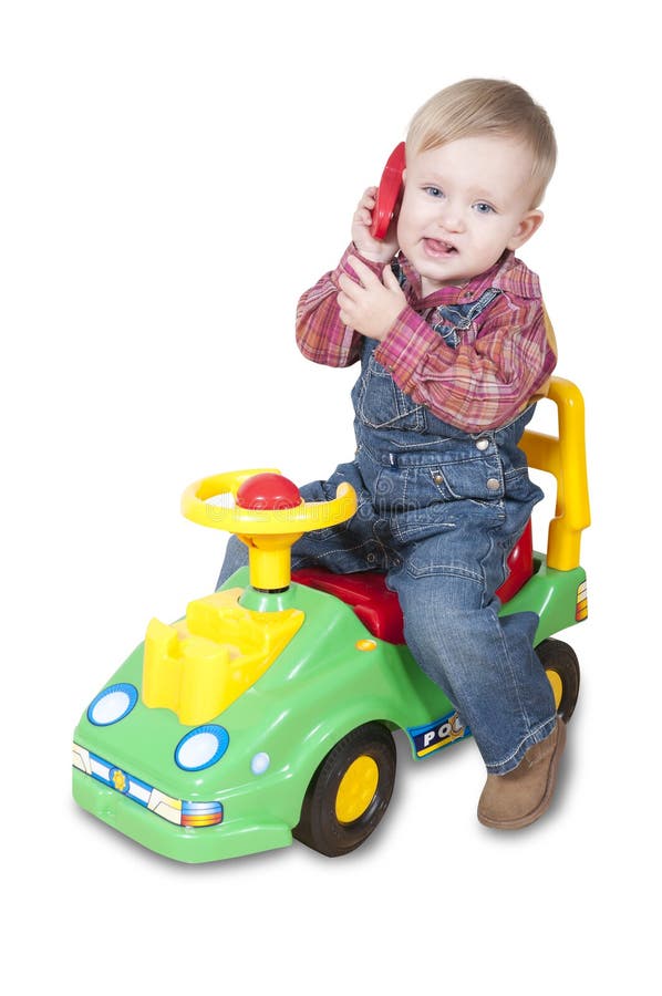 boy-calling-toy-phone-riding-car-36841333.jpg