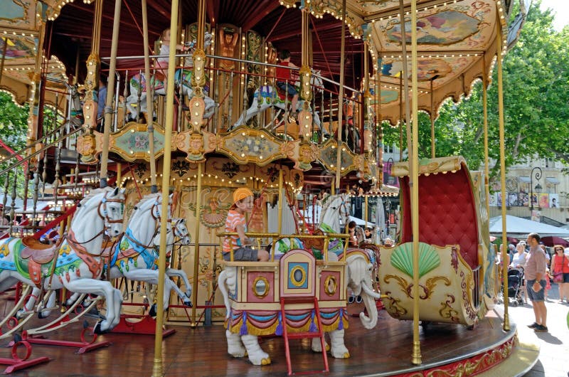 Boy on a Carousel, Avignon, France stock photo Boy on a Carousel, Avignon, France stock photo