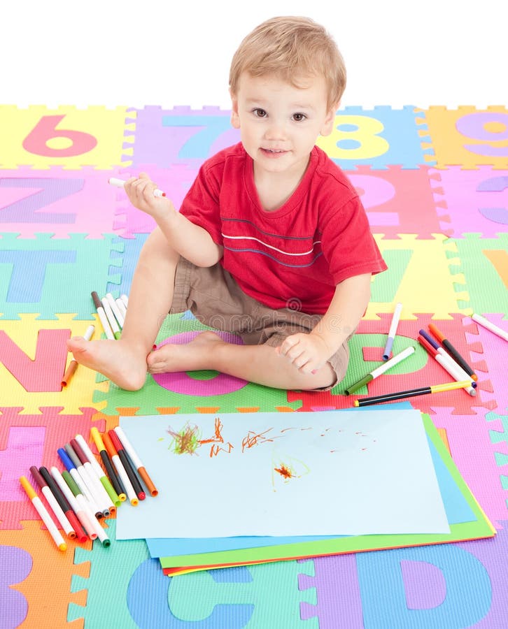 Boy child drawing on kids mat