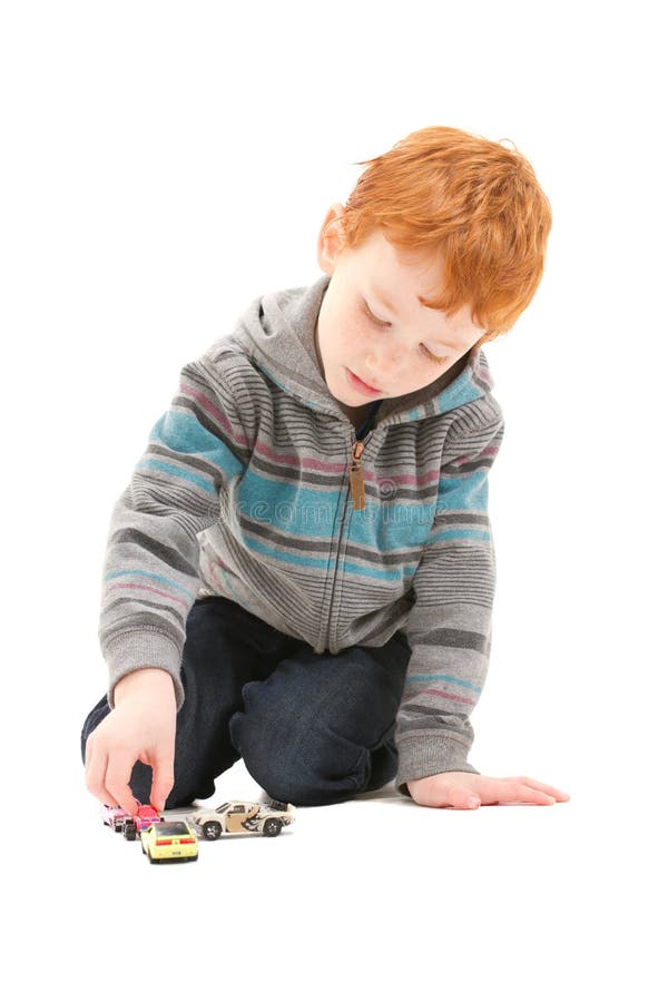 Boy child playing with kids toy cars royalty free stock photos Boy child playing with kids toy cars royalty free stock photos