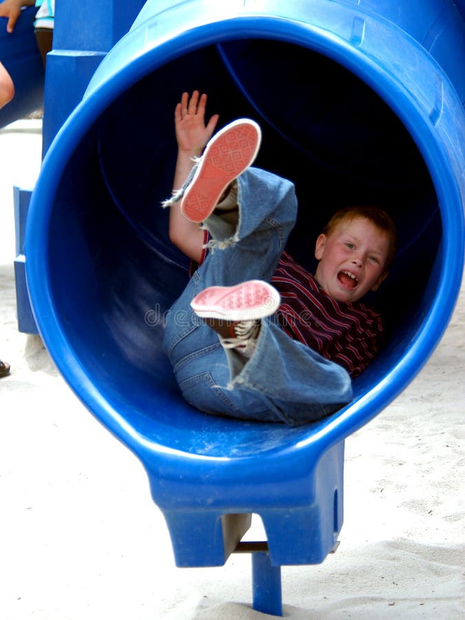 Boy Child In Tube Slide