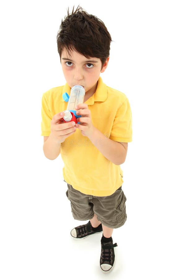 Boy Child Using Asthma Inhaler with Spacer Chamber