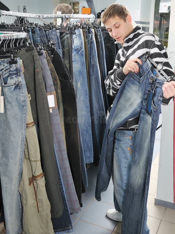 Boy choice jeans in shop